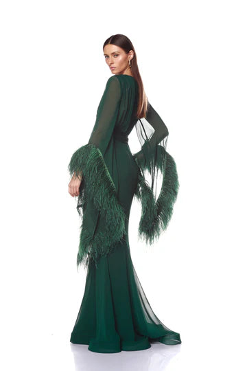 Green evening gown with feathered details on a white background