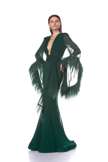 Green evening gown with feathered sleeves on a white background